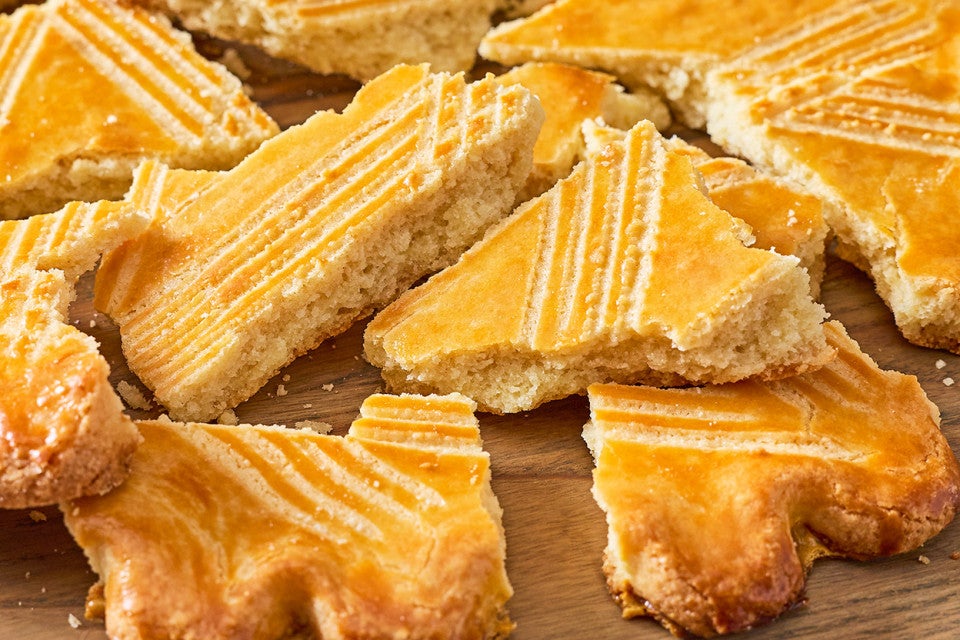 Broyé Du Poitou shortbread shown broken apart with a beautiful golden crumb and bake.