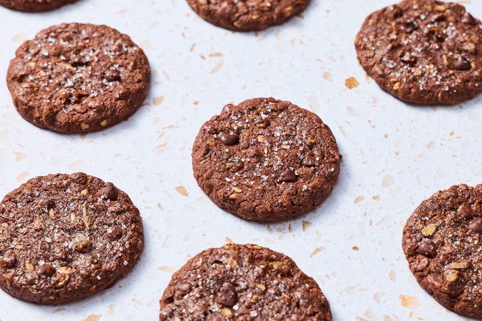 Baked Chocolate Lactation Cookies arranged evenly on a baking sheet.