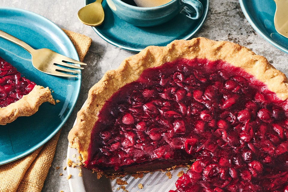 Cranberry-Fudge Pie in a pie tin with a slice removed.