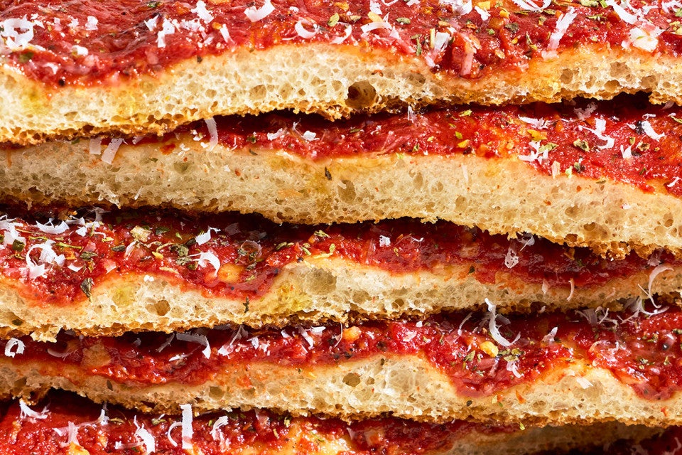 Detailed side photo of a stack of Rhode Island Pizza Strip slices.