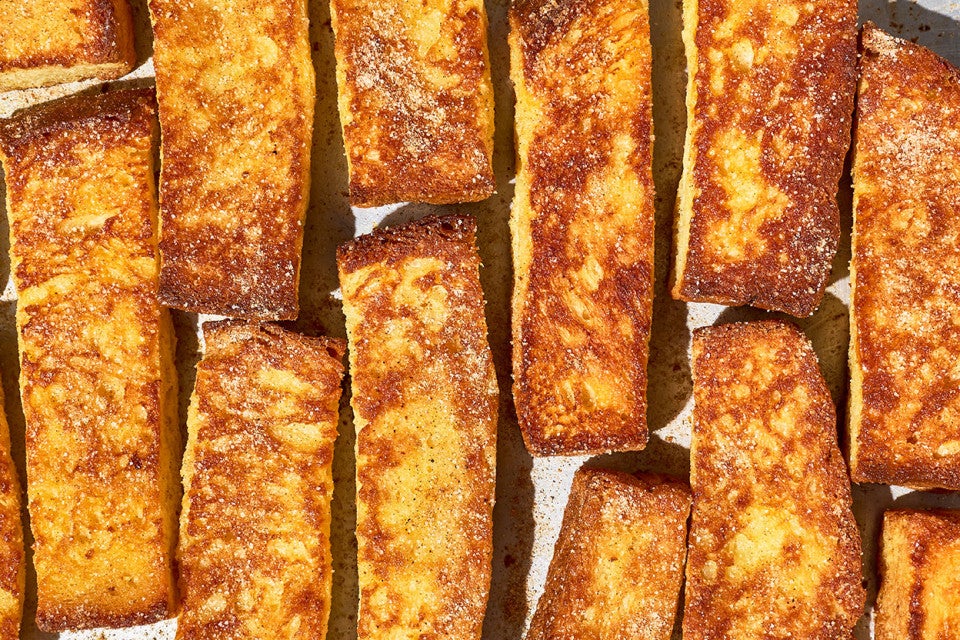 French Toast Sticks laid out on a counter seen from above.