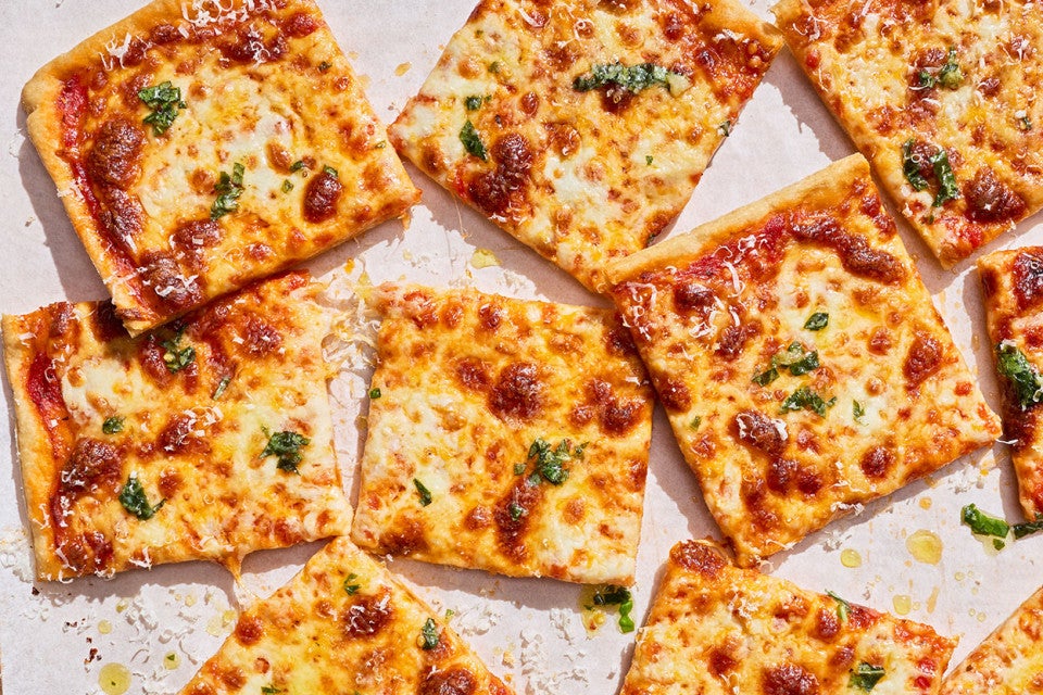 Sliced, freshly baked Gluten-Free Sheet Pan Pizza seen from above.