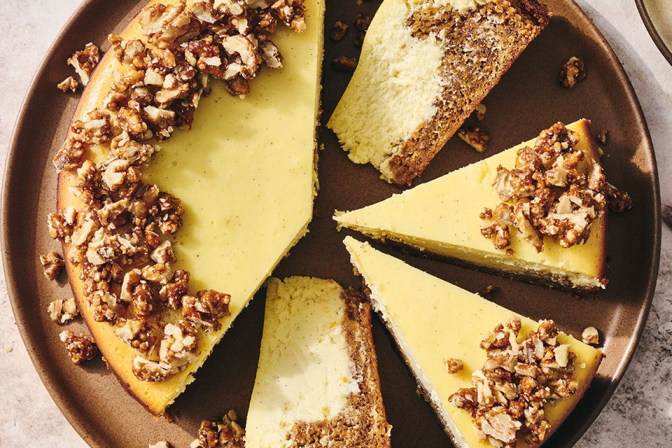 Carrot Cake Cheesecake with golden creamy cheesecake and edged with walnuts.