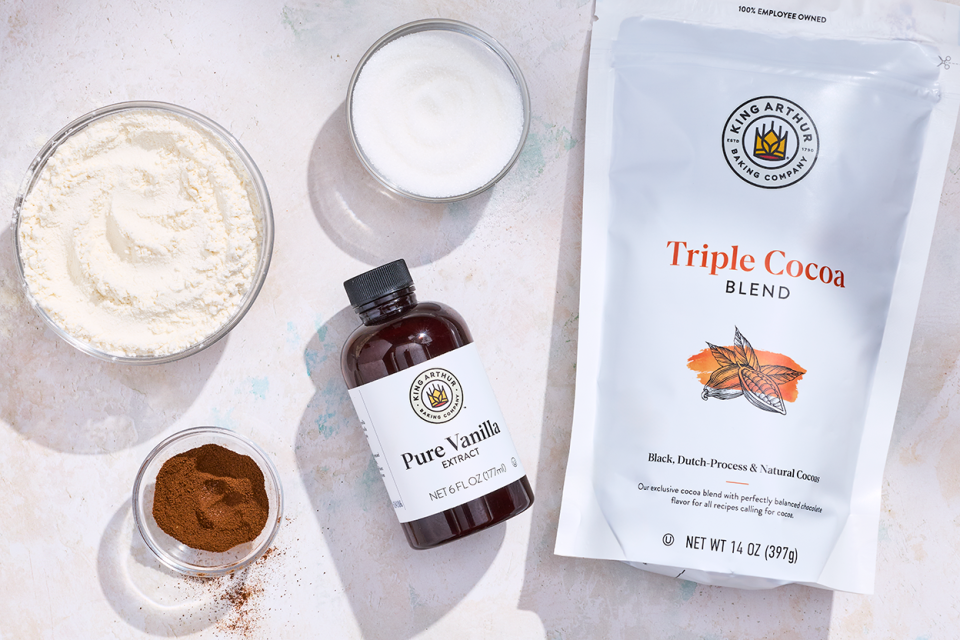 Ingredients to make Small-Batch Chocolate Cupcakes that include King Arthur Baking Vanilla and King Arthur Baking Triple Cocoa powder.