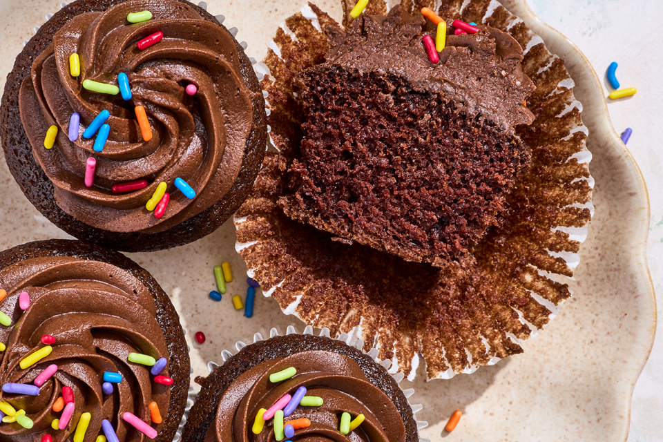 Small-Batch Chocolate Cupcakes seen from above with one sliced in half.