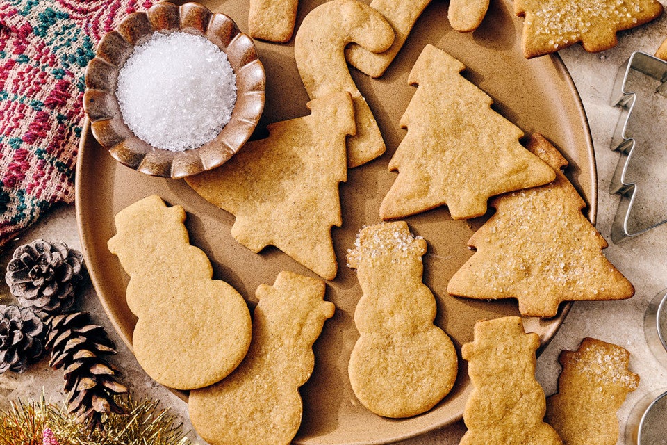 Light Spice Holiday Cookies on a plate with decorative holiday accents.
