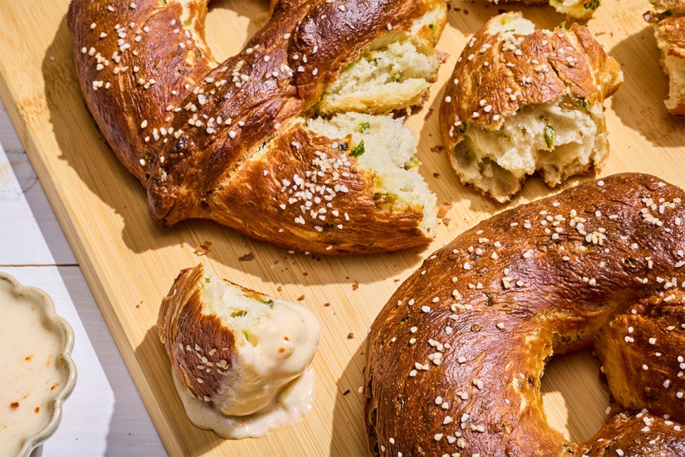 Close-up of Giant Jalapeño Pretzels with dipping sauce