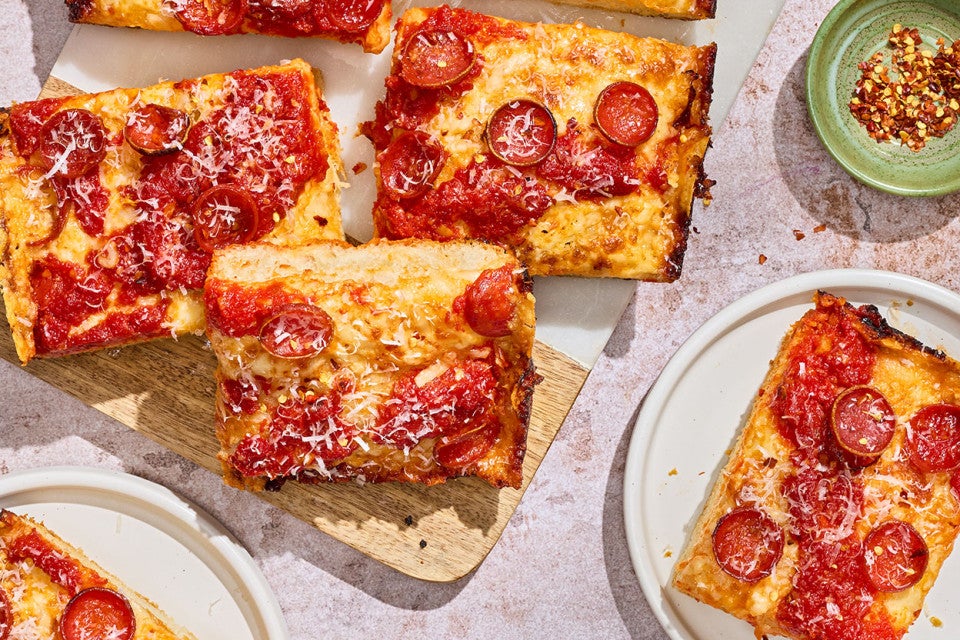 Slices of Weeknight Detroit Pizza arranged on a table.