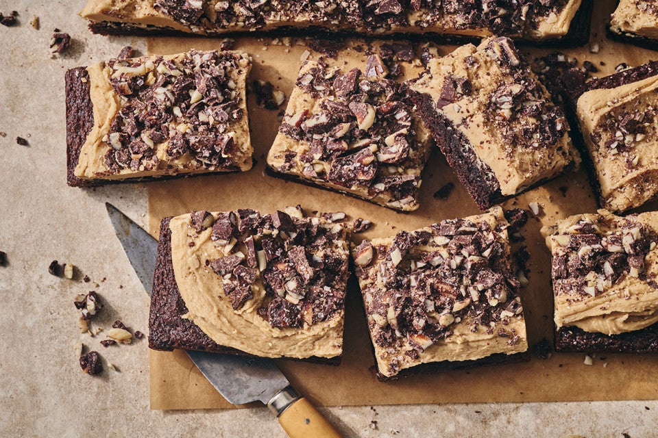 Chocolate Caramel Almond Crunch Brownies sliced and arranged on a counter, seen from above.