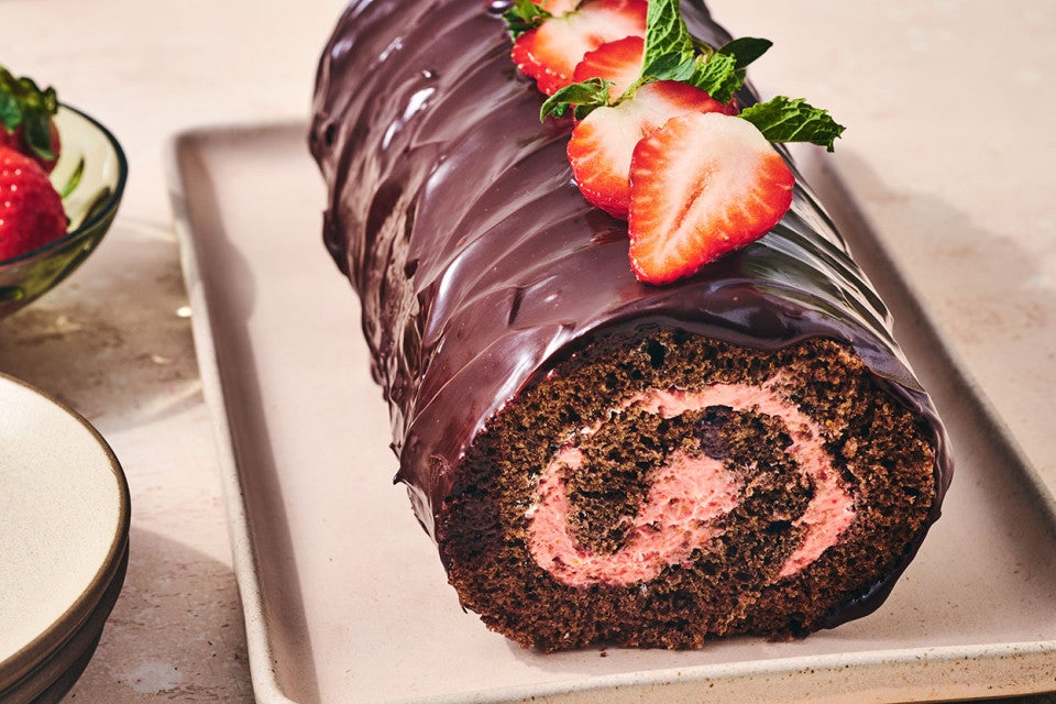 Chocolate Strawberry Roll Cake on a sheet pan