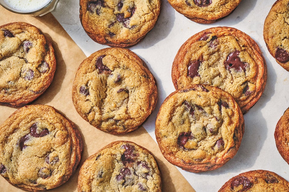 Classic Chocolate Chip Cookies spread on a white counter.