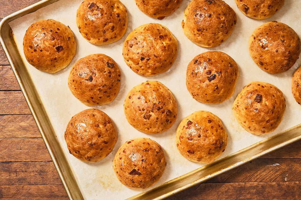 Gluten-Free Bacon Cheddar Rolls on a sheet tray fresh out of the oven.