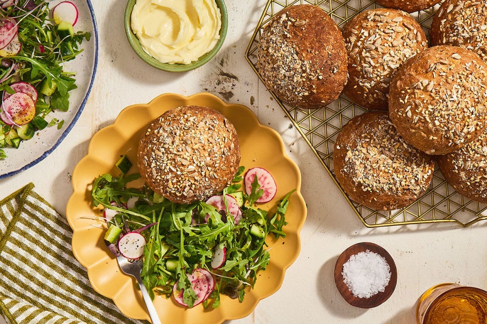 Gluten-Free Seeded Hearth Rolls on a table.