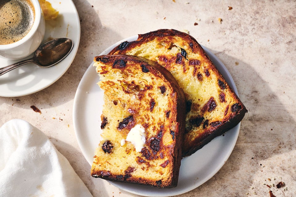 Overnight Panettone sliced and toasted and arranged on a plate.