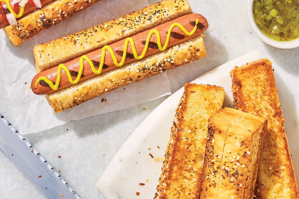 A hotdog and Sourdough Hot Dog Buns on a plate.