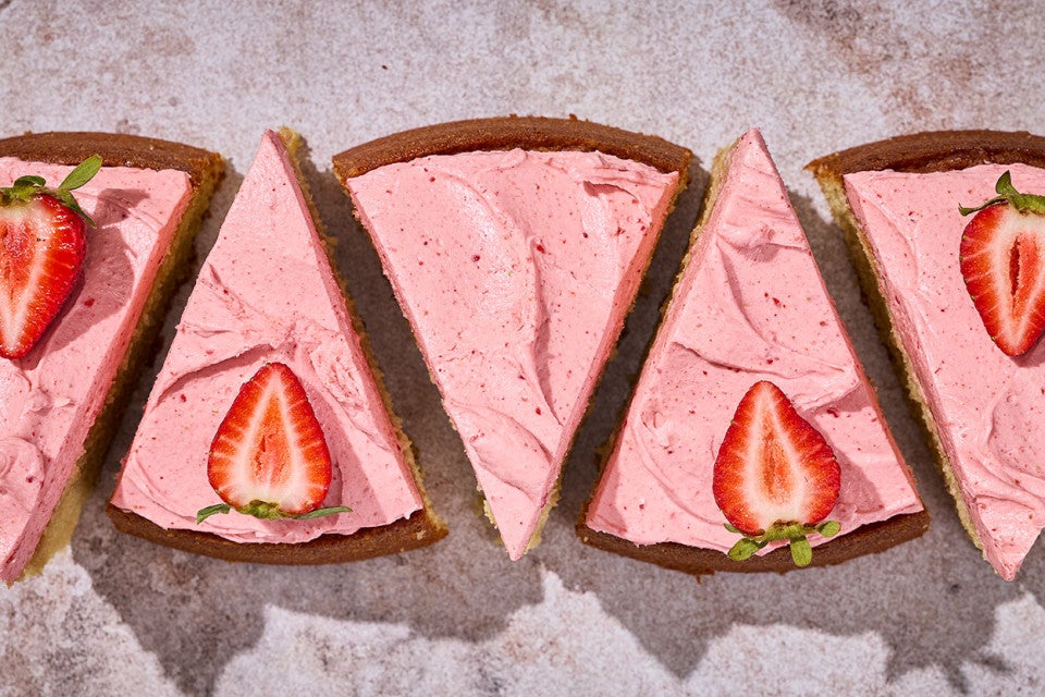 5 slices of Brown Sugar Strawberry Frosted Cake aligned on a counter