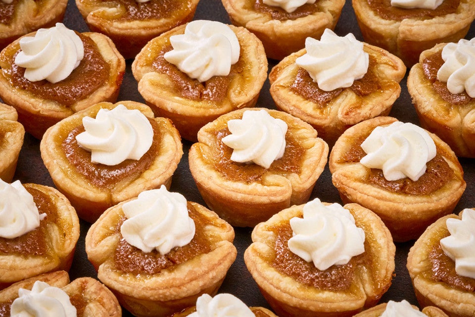 Mini Pumpkin Pies arranged on a counter