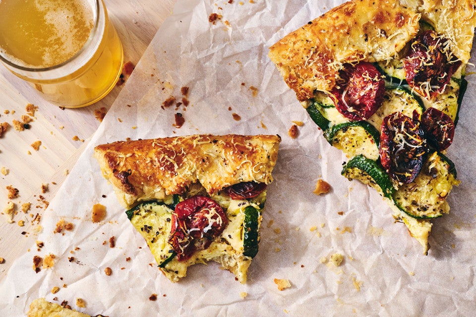 Savory Zucchini Galette sliced and partially eaten on a counter, seen from above