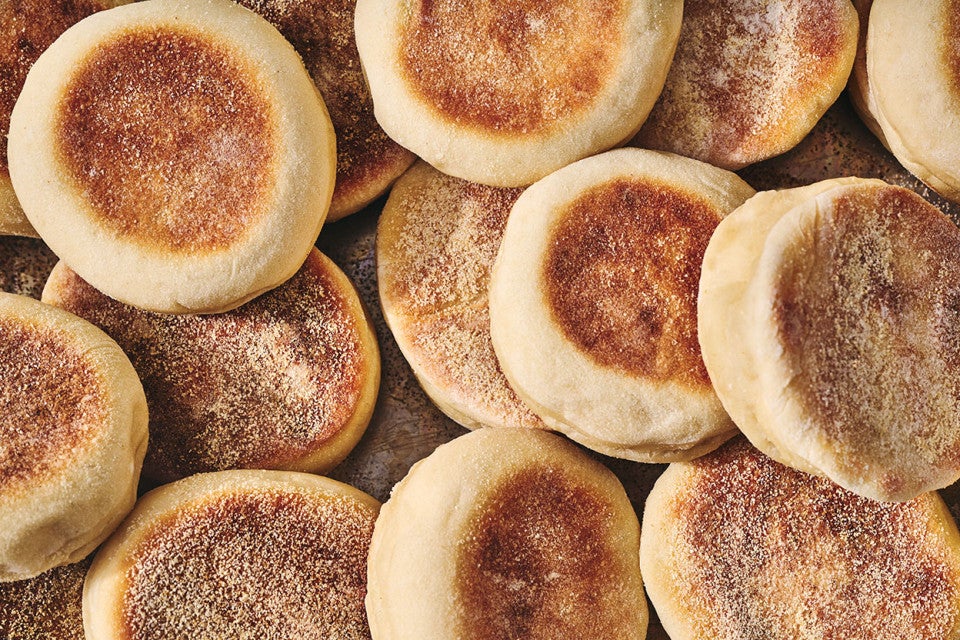 Sourdough English Muffins arranged on a counter and seen from overhed