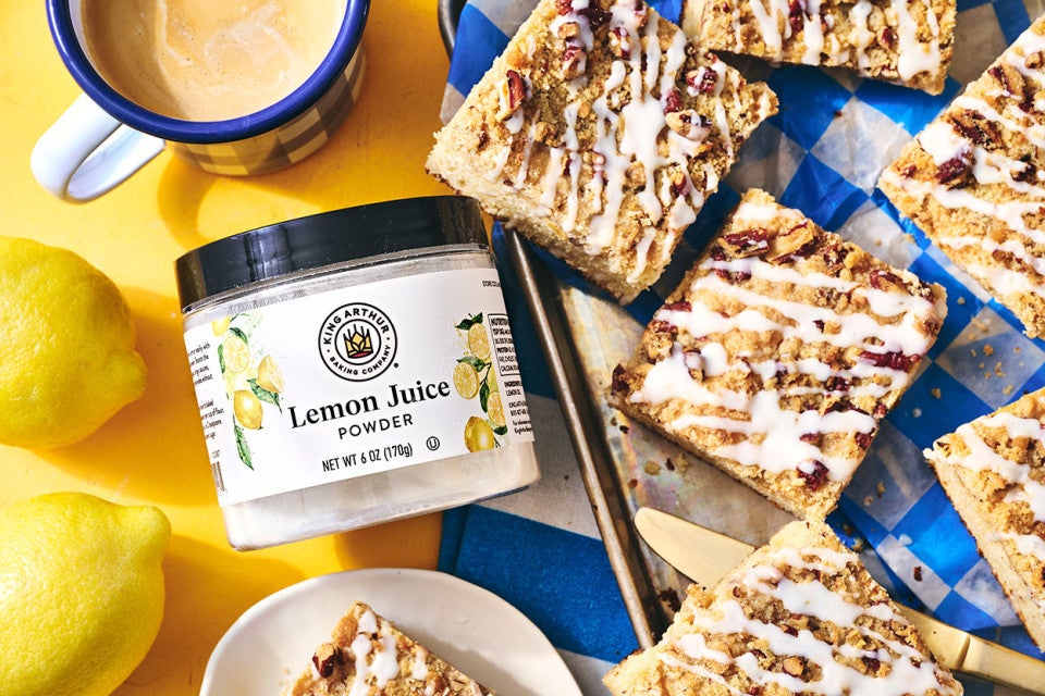 Lemon Streusel Coffee Cake on a counter with a jar of Lemon Juice powder from King Arthur Baking