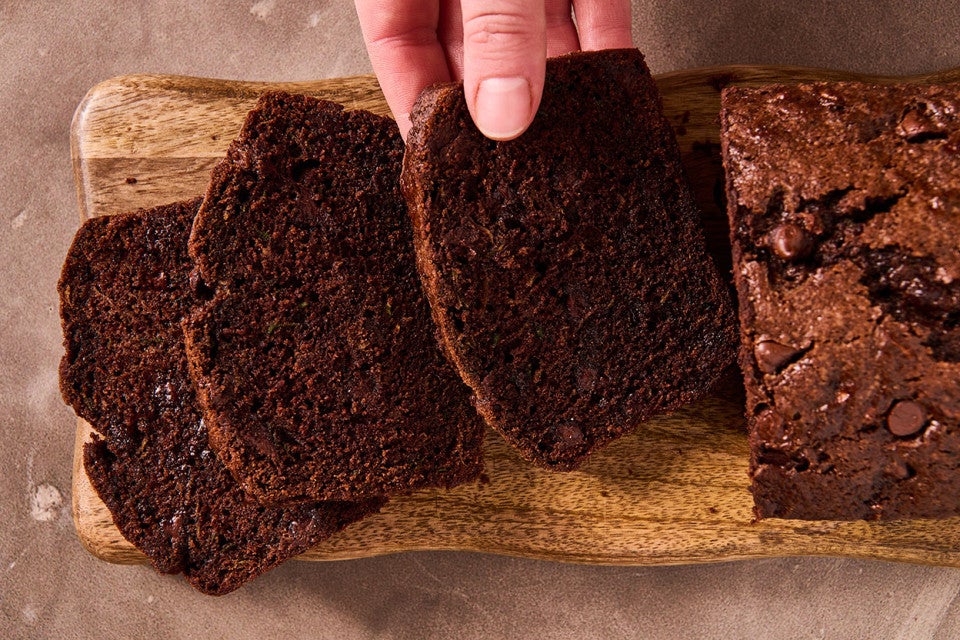 Double Chocolate Zucchini Bread sliced on a cutting board