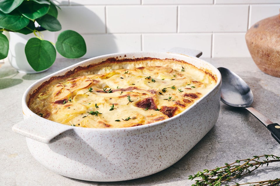 Scalloped Potatoes fresh out of the oven in a stoneware pan