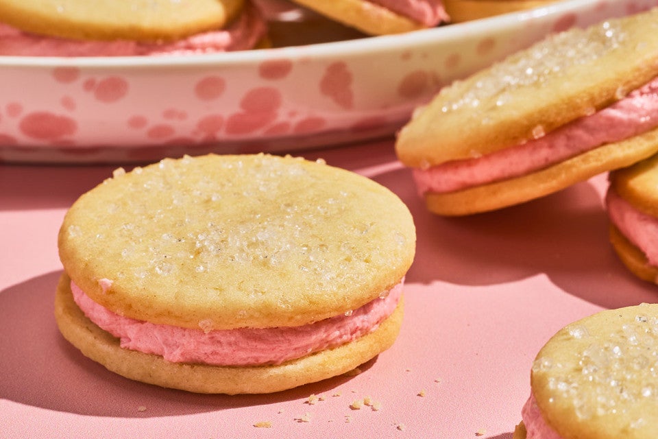 Strawberry Shortcake Cookies on a pink counter seen from the side