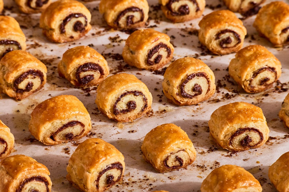 Chocolate Croissant Cookies fresh out of the oven on parchment paper