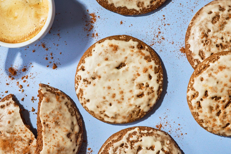 Gingerbread Latte Cookies on a blue counter with a latte in the frame