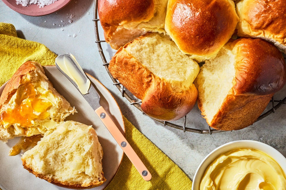 Japanese Milk Bread Rolls arranged on a table and seen from above.