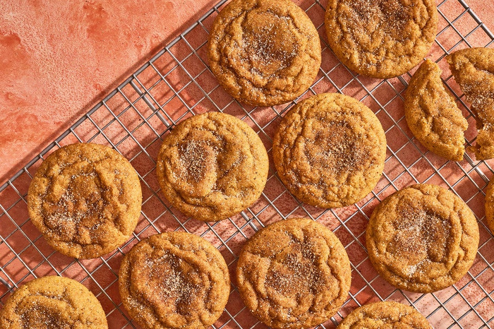Pumpkin Snickerdoodle Cookies arranged on a cooling rack and seen from above