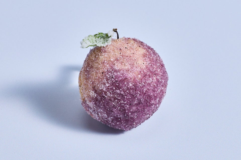 A single Sugar Plum Cookie on a blue backdrop