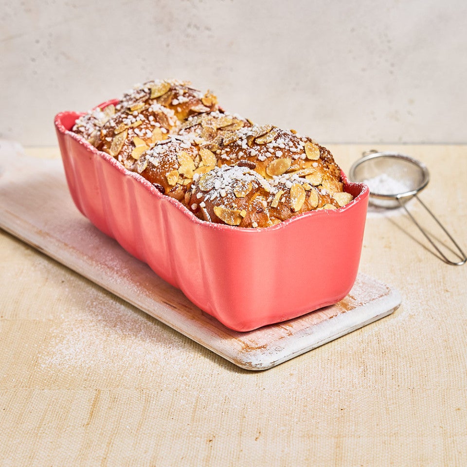 Almond Croissant Milk Bread in a pink loaf pan