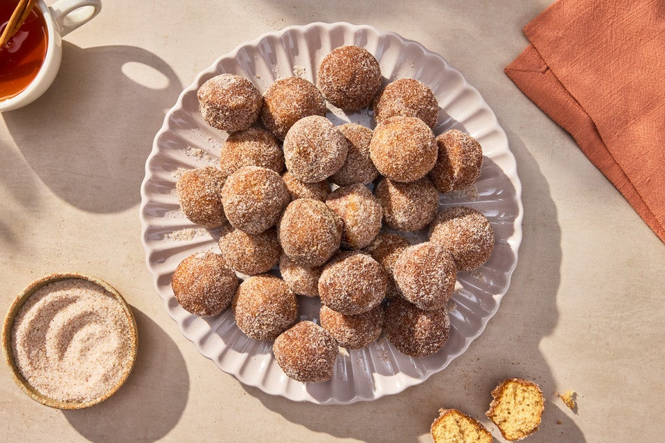 Apple Cider Doughnut Holes arranged on a plate