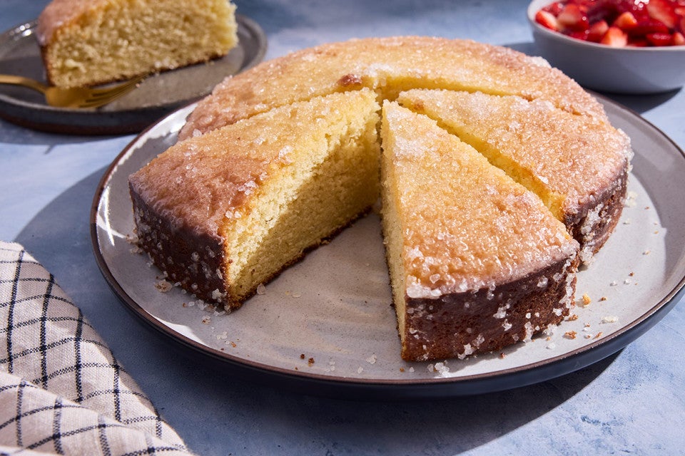 Lemon Ricotta Cake sliced on a plate