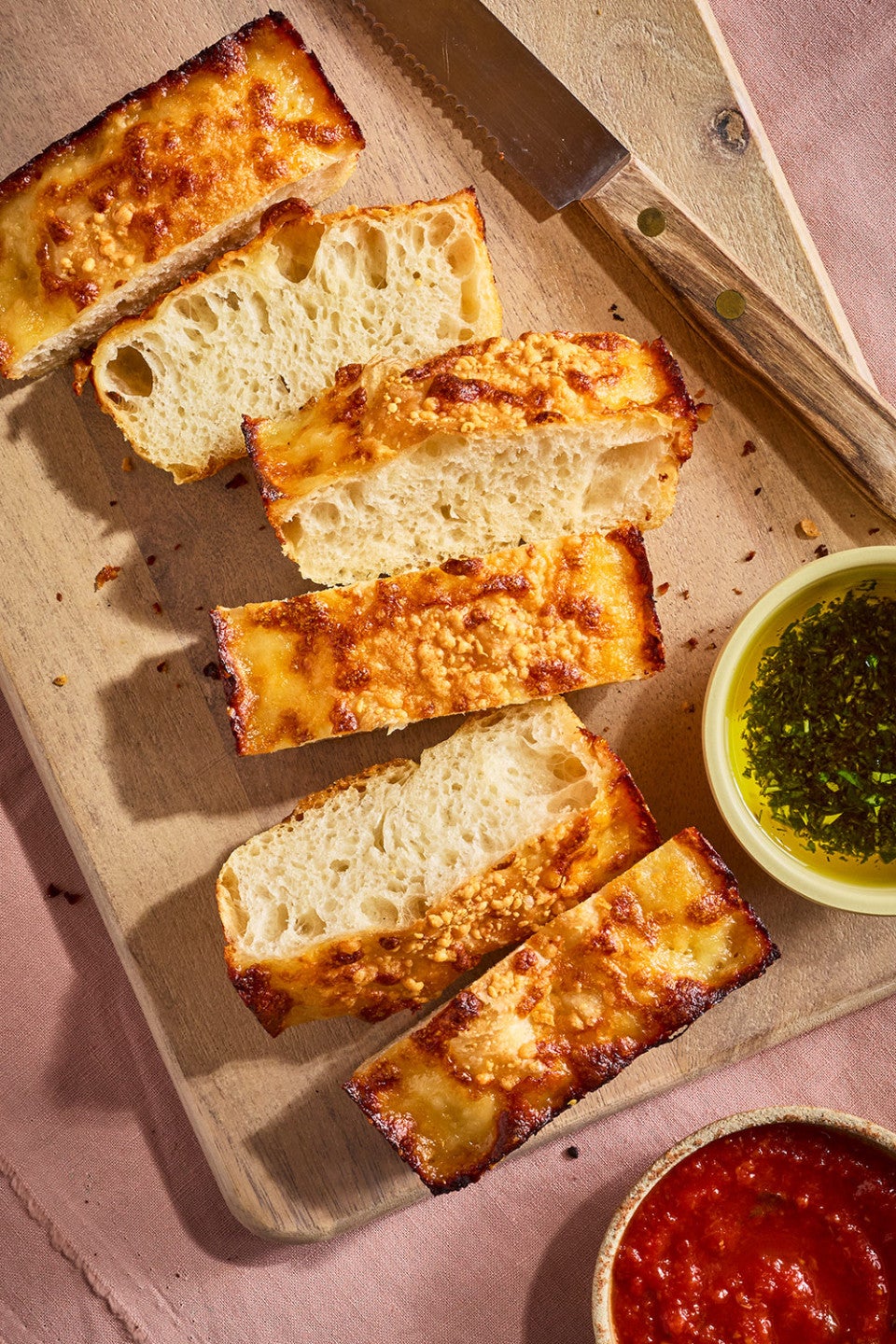 Small-Batch Cheesy Focaccia sliced on a cutting board