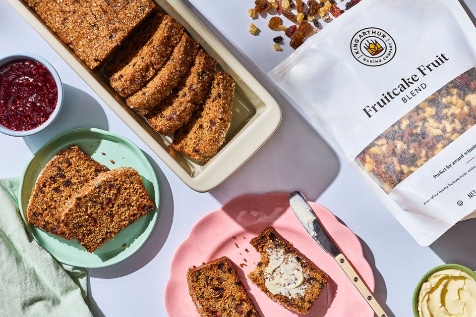 Tea Brack arranged on a table and seen from above with a bag of King Arthur Baking Fruitcake Fruit