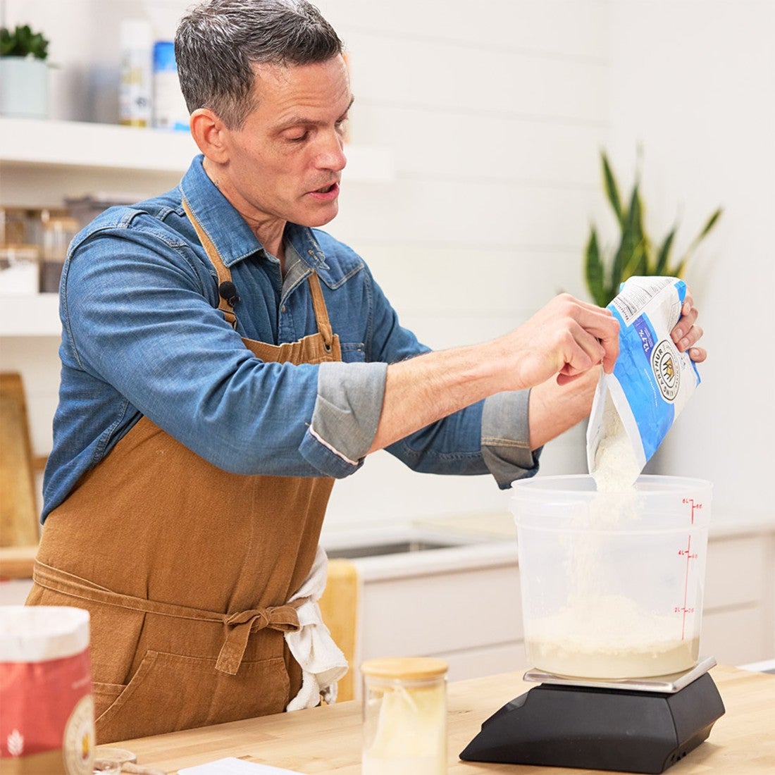 Martin Philip adding flour