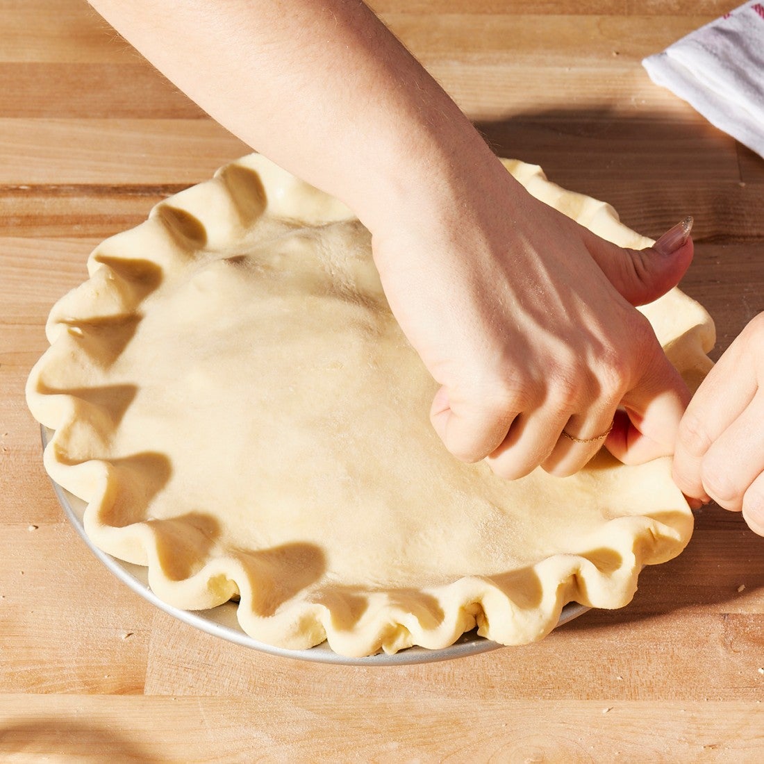 Pie crust being crimped