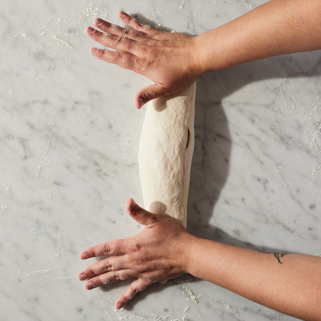 French Bread dough being rolled out