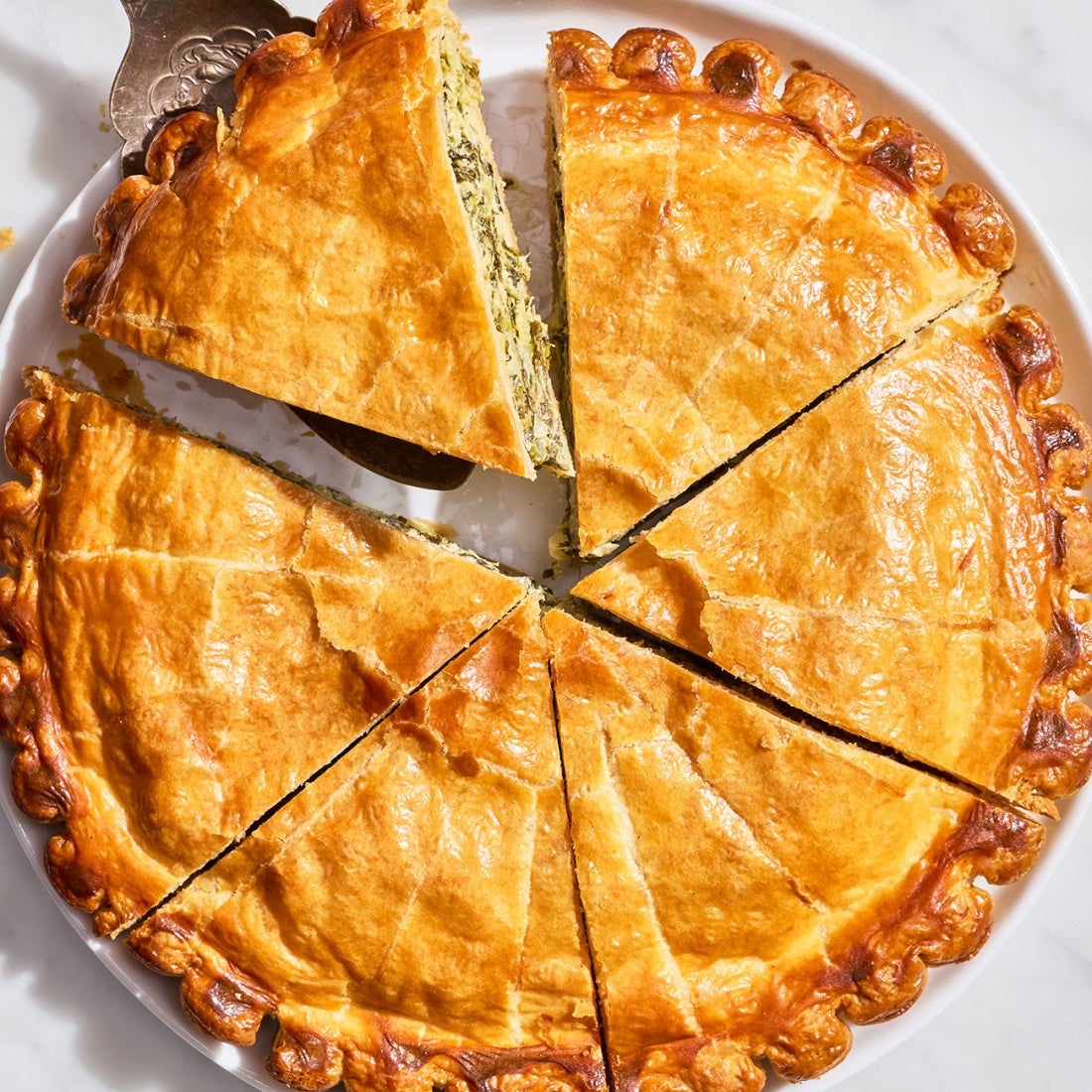 Artichoke Spinach Pithivier seen sliced from above.