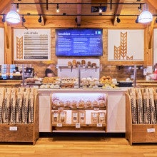 Looking at the menu boards and interior of King Arthur Baking's Norwich Cafe
