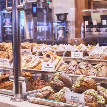 Looking at the baked goods and interior of King Arthur Baking's Norwich Cafe