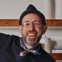 A headshot of David Tamarkin