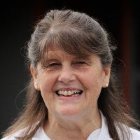 A headshot of Susan Miller