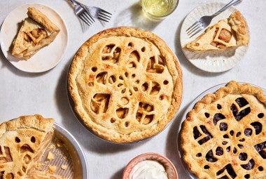 Three Apple Pie with Make-Ahead Filling in pie pans and two slices on plates