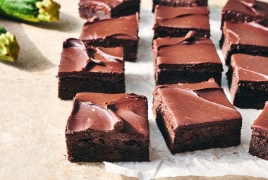 Zucchini Brownies cut into pieces and on a counter