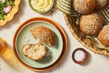 A Gluten-Free Seeded Hearth Roll split on a plate.