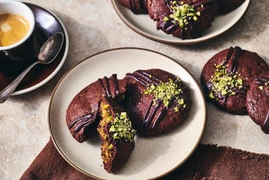 Dubai Chocolate Cookies arranged on a counter and plate with a cup of coffee