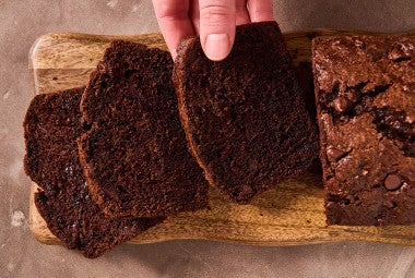 Double Chocolate Zucchini Bread sliced on a cutting board